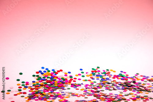 colorful confetti on pinkn background