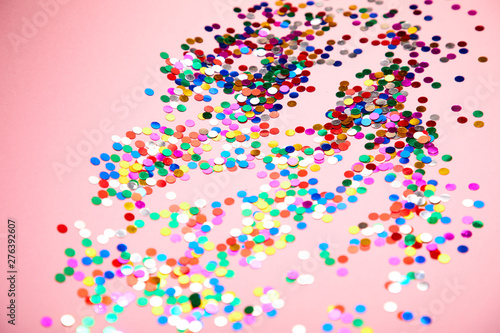 colorful confetti on pinkn background