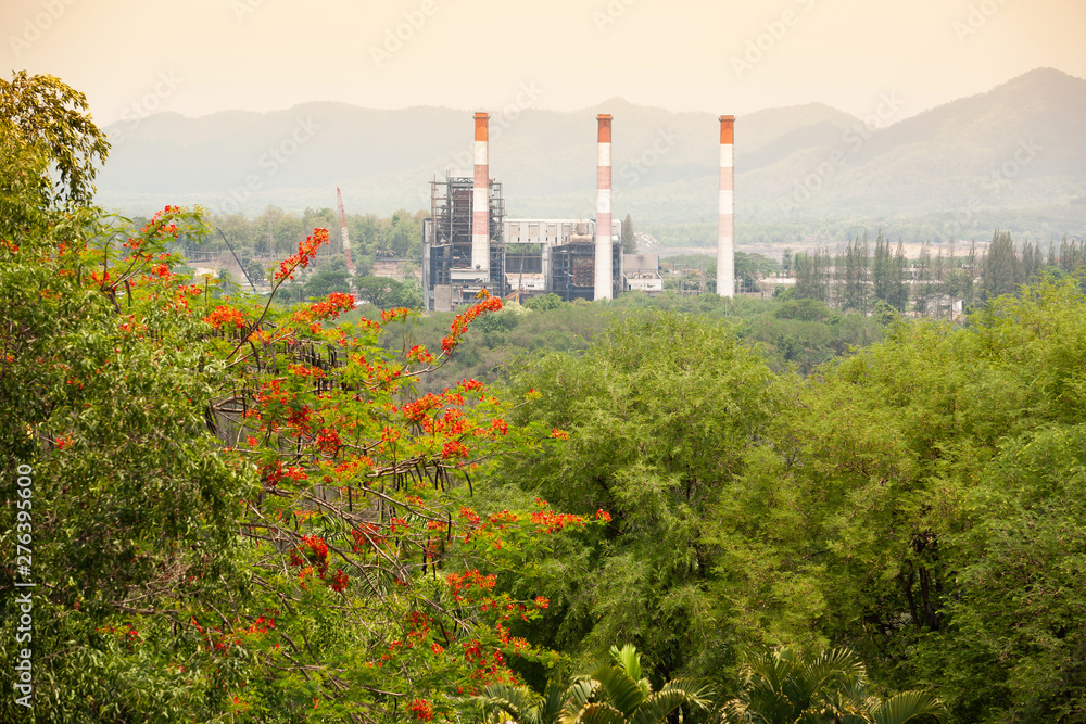 Obraz premium High angle view of an old coal mine with pipes in a valley.