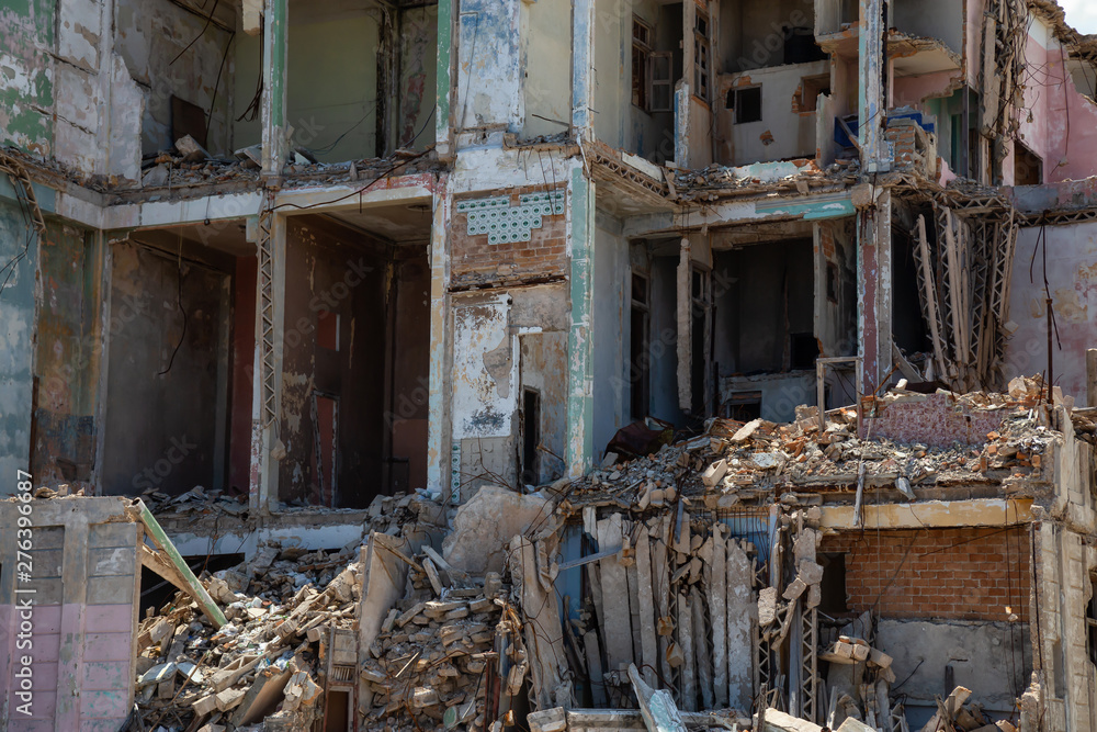 View of the broken and demolished residential homes in the Old Havana City, Capital of Cuba, during a cloudy and sunny day. View of the broken and demolished residential homes in the Old Havana City, Capital of Cuba, during a cloudy and sunny day.
