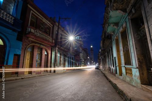 Street view of the residential neighborhood in the Old Havana City  Capital of Cuba  during night time after sunset.