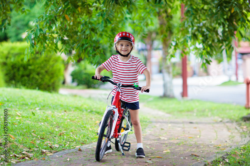 Fototapeta Naklejka Na Ścianę i Meble -  Kids on bike. Child on bicycle. Kid cycling.