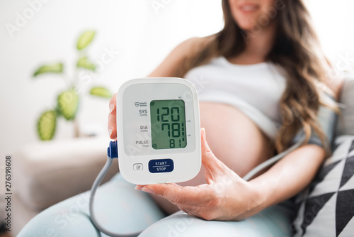 Blood Pressure, Pregnant Woman showing her blood pressure.