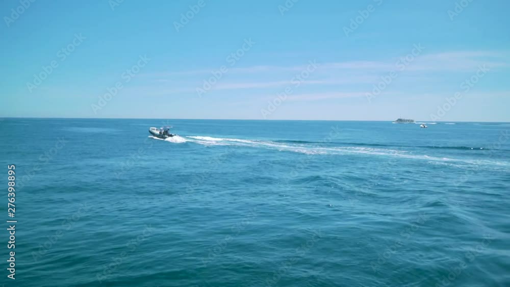 A view of a boat sailing though the Italian sea A view of a boat sailing though the Italian sea
