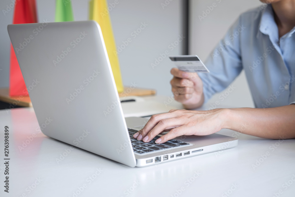 Woman using credit card register security code and payments online shopping and customer service network connection market, using on laptop, Internet Online shopping or internet banking concept Woman using credit card register security code and payments online shopping and customer service network connection market, using on laptop, Internet Online shopping or internet banking concept
