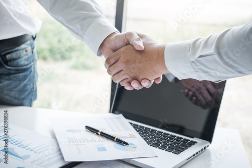 Finishing up a meeting, Business handshake after discussing good deal of Trading to sign agreement and become a business partner, contract for both companies, Successful businessman handshake