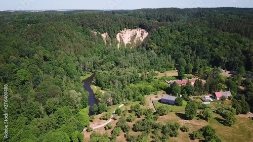 Aerial, drone shot, over Vilnele river, towards the Puckoriu atodanga, a geological monument, the highest exposure in Lithuania, sunny summer day, in Pavilniai regional park, Belmontas, near Vilnius photo