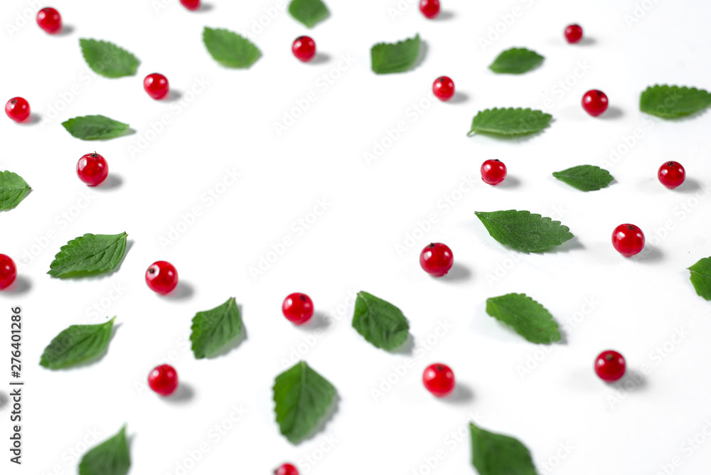 Fruit pattern made of fresh berries, green leaves and frame on white background. Concept of healthy food. Flat lay, top view, copy space Fruit pattern made of fresh berries, green leaves and frame on white background. Concept of healthy food. Flat lay, top view, copy space