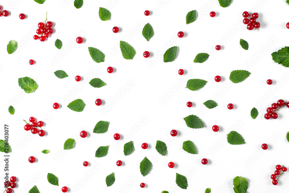 Fruit pattern made of fresh berries, green leaves and frame on white background. Concept of healthy food. Flat lay, top view, copy space Fruit pattern made of fresh berries, green leaves and frame on white background. Concept of healthy food. Flat lay, top view, copy space