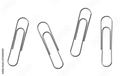 Silver paper clips isolated on a white background photo