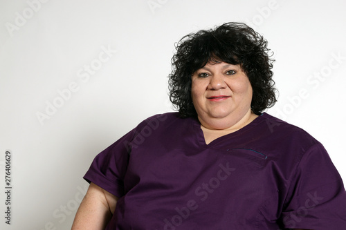 Portrait of an attractive plus sized woman on white background with copy space