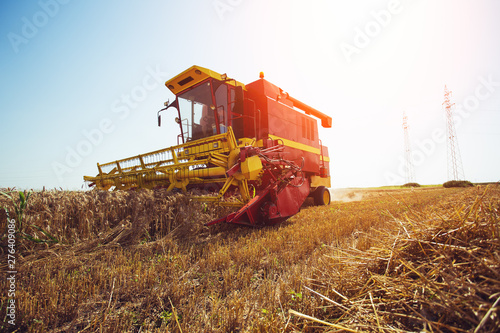 Combine harvester working on a wheat field