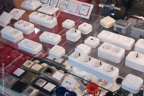 Electric sockets and switches on a show-window of shop. Sales