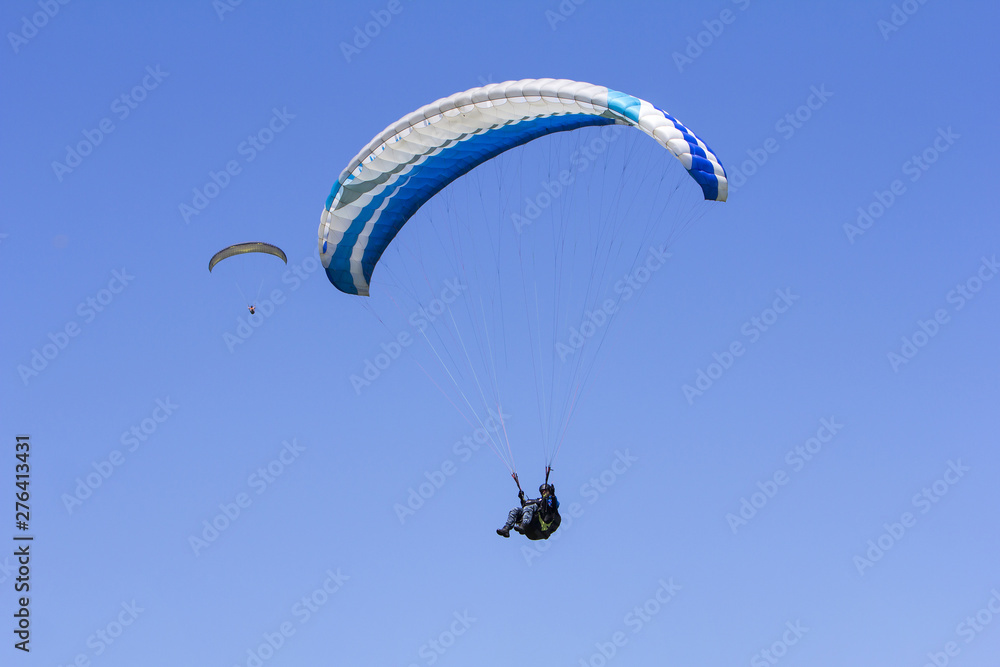 Paragliding in the blue sky as background extreme sport Paragliding in the blue sky as background extreme sport