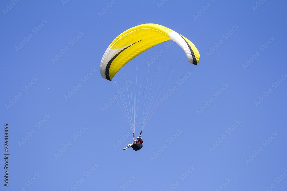 Paragliding in the blue sky as background extreme sport Paragliding in the blue sky as background extreme sport