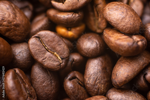 Coffee beans background. Brown roasted coffee beans. Represent breakfast, energy, freshness or great aroma,Dark background with copy space, close-up