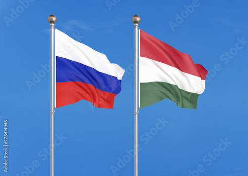 Russia vs Hungary. Thick colored silky flags of Russia and Hungary. 3D illustration on sky background. – Illustration