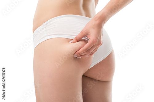 partial view of sexy woman in panties touching buttocks isolated on white © LIGHTFIELD STUDIOS