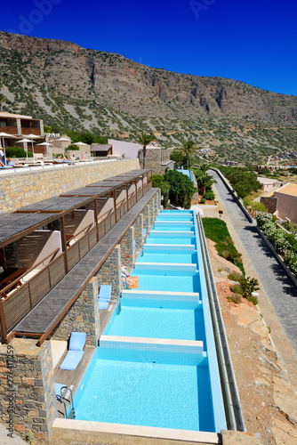 Swimming pool at luxury hotel with a view on Spinalonga Island, Crete, Greece