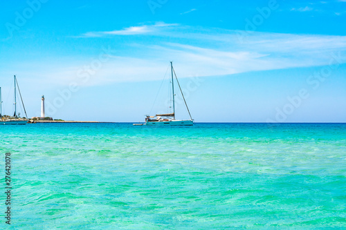 Crystal clear light blue water on sandy beach San Vito lo Capo, Sicily, Italy