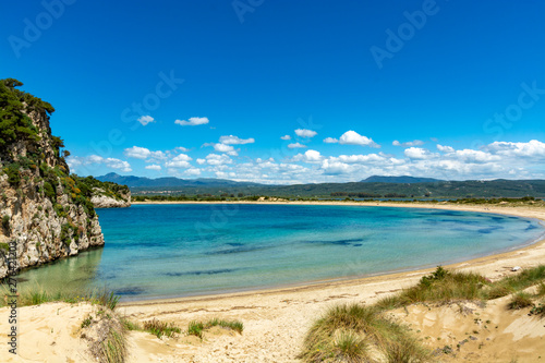 Fototapeta Naklejka Na Ścianę i Meble -  Voidokilia Beach, popular white sand and blue clear water beach in Messinia in Mediterranean area in shape of Greek letter omega, Peloponnese, Greece.