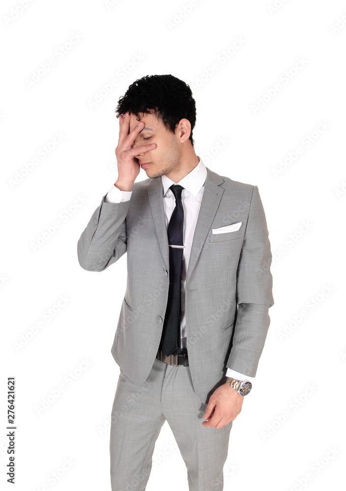 Man putting hand over face is ashamed over his actions Man putting hand over face is ashamed over his actions