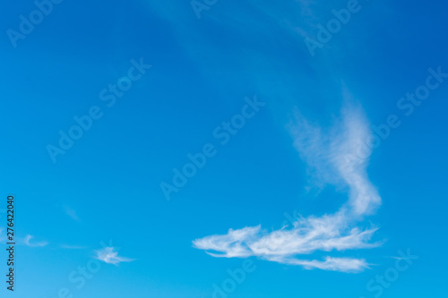 Beautiful cirrostratus clouds in the blue sky shaped like a Chinese dragon photo