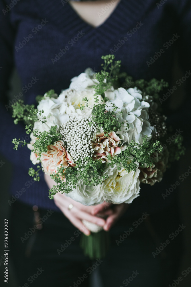 Beautiful bouquet of flowers in the hands of a woman Beautiful bouquet of flowers in the hands of a woman