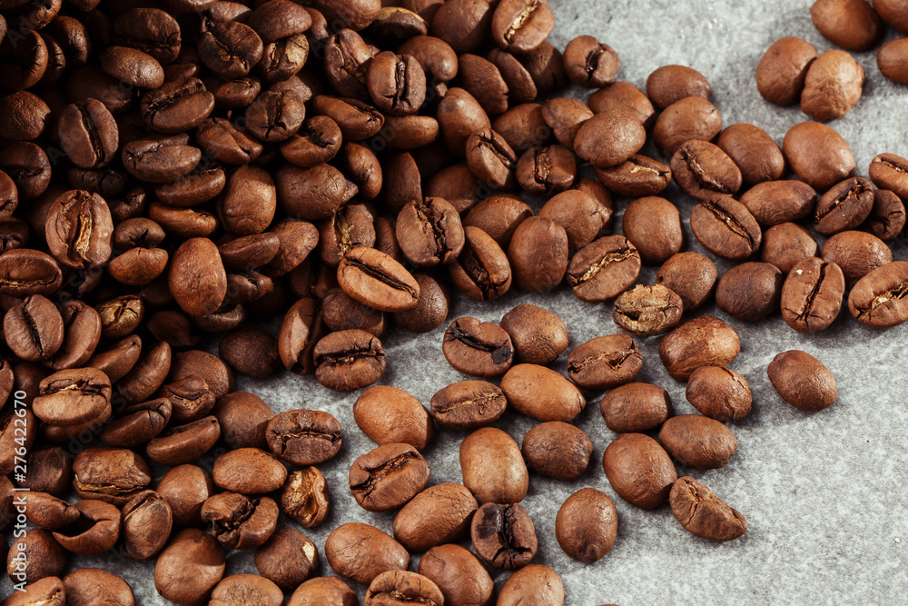 Isolated coffee bean. closeup photo. Top view. Roasted coffee beans background Isolated coffee bean. closeup photo. Top view. Roasted coffee beans background