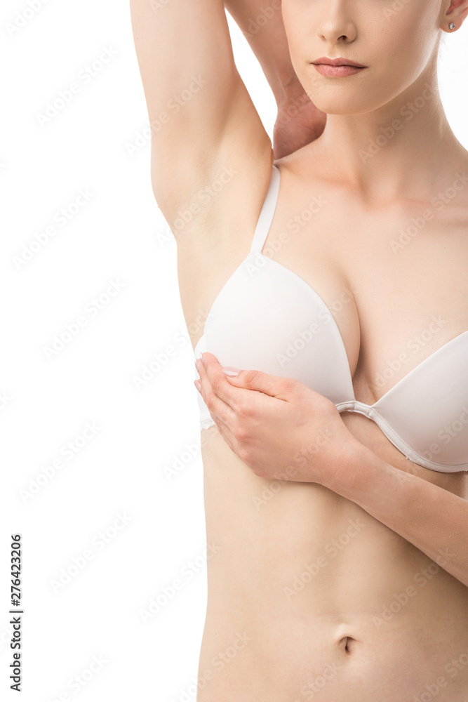 partial view of woman in bra doing breast self-examination isolated on white