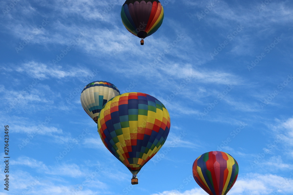 Fototapeta premium Several Hot Air Balloons with cyrus clouds