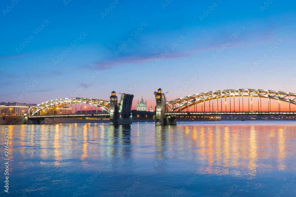 Obraz premium View of the Smolny Cathedral and the divorced Bolsheokhtinsky bridge during the white nights in June. St. Petersburg. Russia