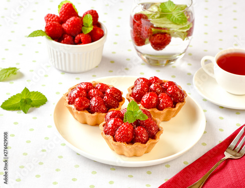 Homemade mini tarts with raspberries fruits