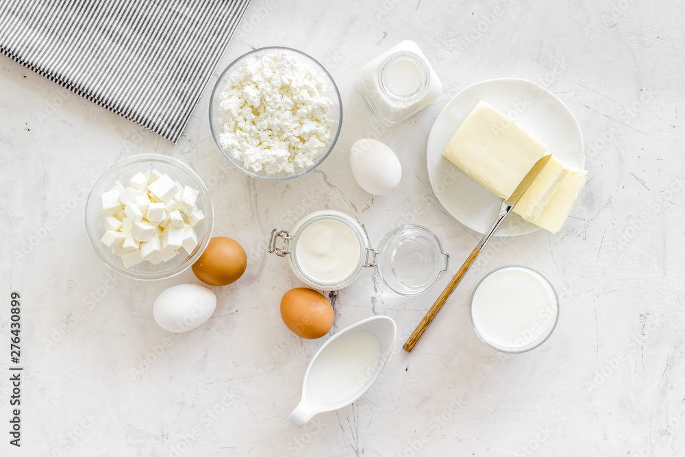 Breakfast on farm with dairy products on marble background top view Breakfast on farm with dairy products on marble background top view