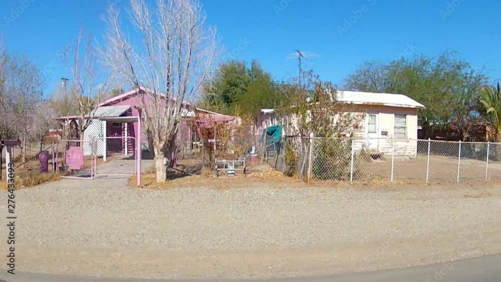 Driving By Small Homes In Dusty Desert Town Driving By Small Homes In Dusty Desert Town
