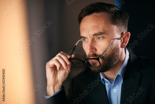 Close up shot of a worker looking directly at the computer screen