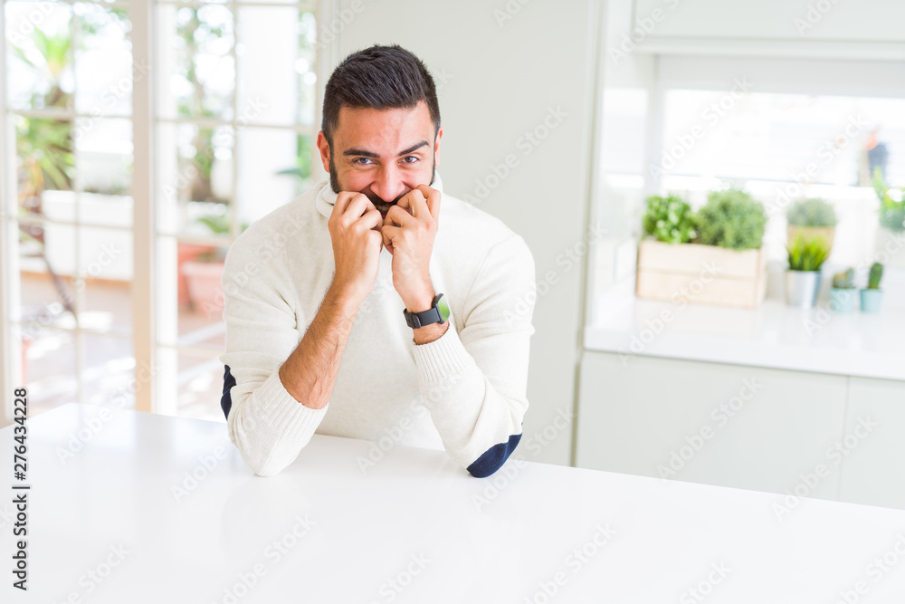 Handsome man smiling cheerful with a big smile on face showing teeth, positive and happy expression Handsome man smiling cheerful with a big smile on face showing teeth, positive and happy expression