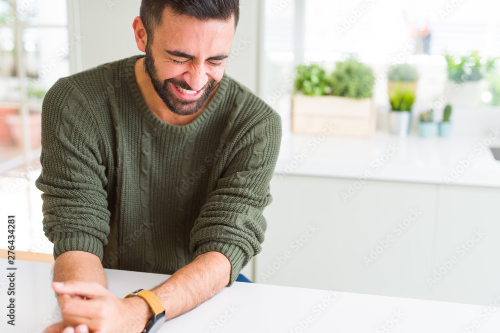 Fototapeta premium Handsome man smiling cheerful with a big smile on face showing teeth, positive and happy expression