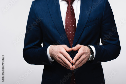 Φωτογραφία partial view of confident businessman showing steeple gesture isolated on grey,