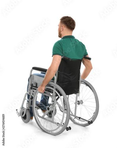 Konstfotografi Handsome young man in wheelchair isolated on white
