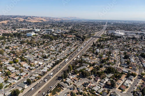 Aerial view of streets, buildings and traffic along the 880 freeway near Hayward, San Leandro and Oakland, California. photo