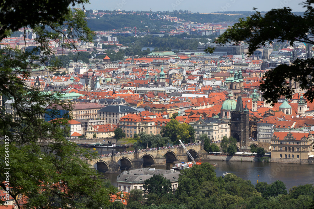 Summer Prague City with Charles Bridge and green Nature from the Hill Petrin, Czech Republic