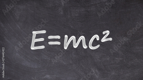 Einstein relativity equation written on blackboard