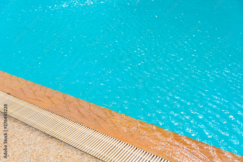 Beautiful pool side for relaxation in summer, ripple water in swimming pool