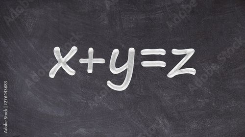 X plus Y equals Z written on blackboard