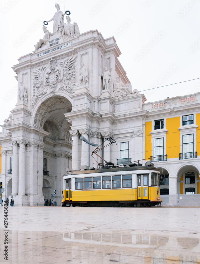 Yellow Cable Car in Commerce Square, Lisbon, Portugal
