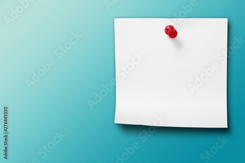 Blank white paper on wooden table background