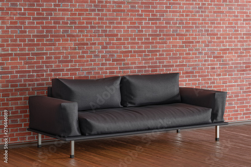 Leather couch in interior of living room with wooden flooring