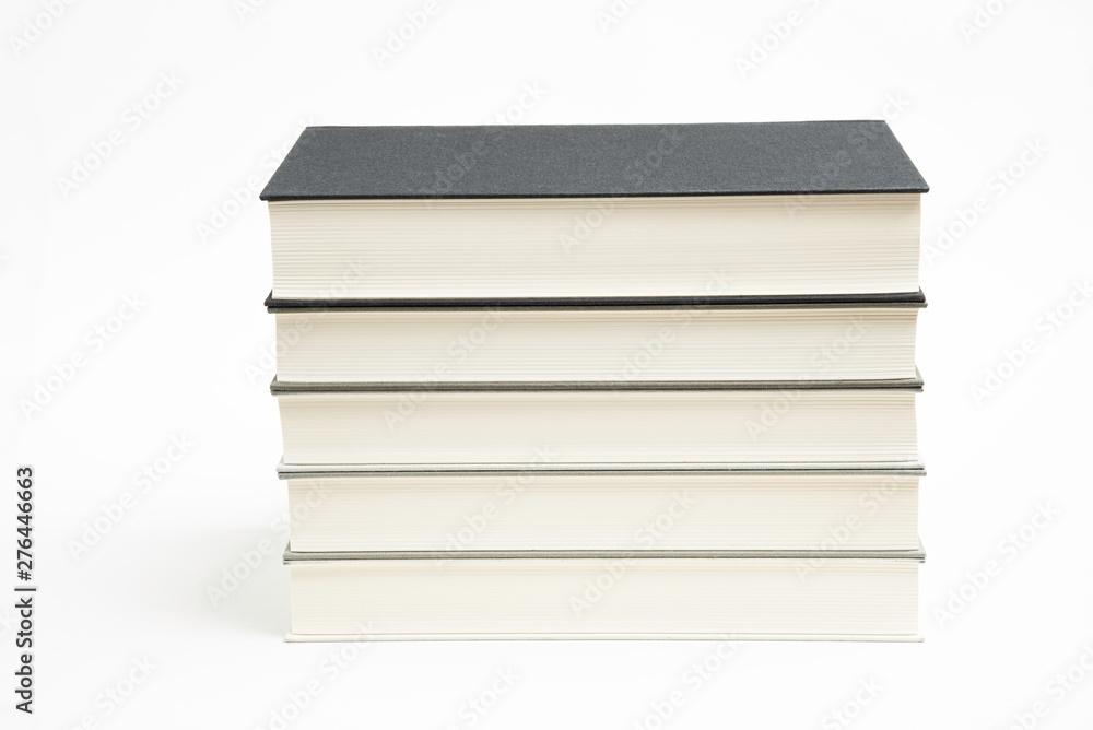 A Set Of Neatly Stacked Monochromatic Cloth Bound Books A Set Of Neatly Stacked Monochromatic Cloth Bound Books