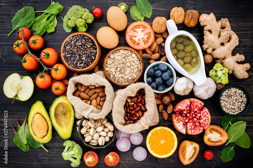 Ingredients for the healthy foods selection. The concept of healthy food set up on wooden background.